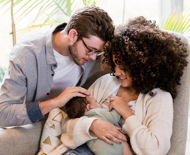 Parents holding baby