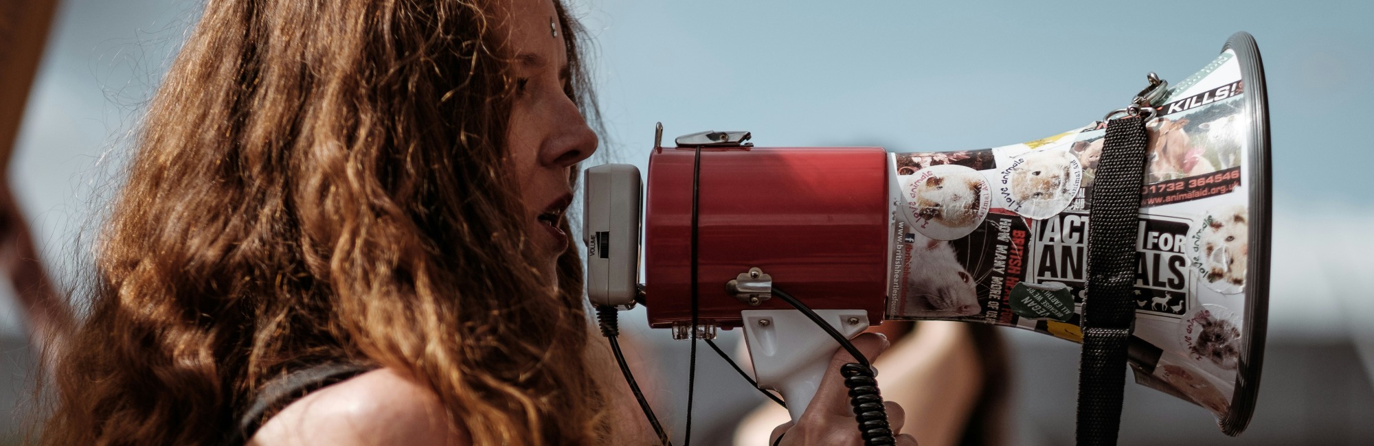 red headed woman with megaphone