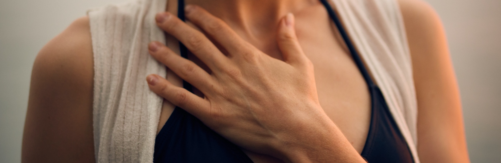 woman with hand on her heart